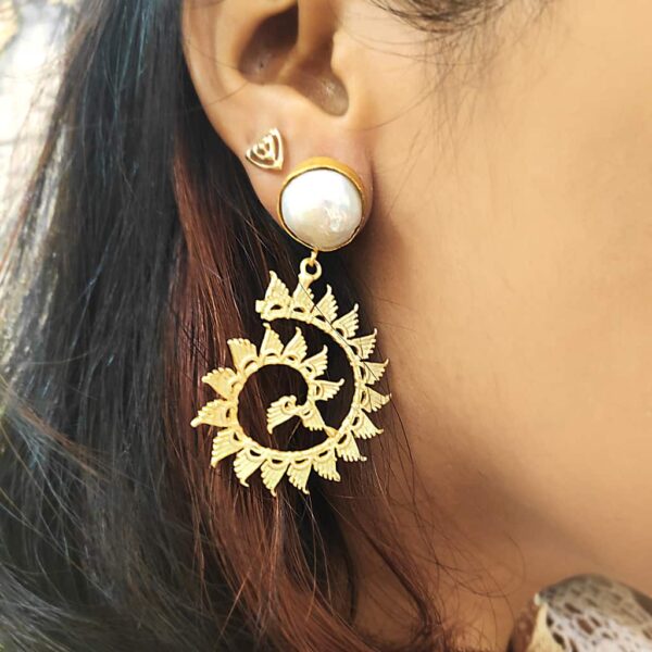 Textured Golden Spiral Baroque Pearl Earrings on Ears