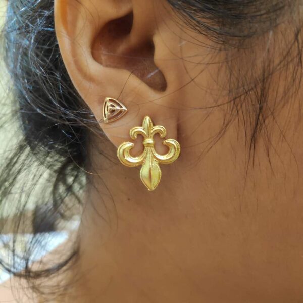 Fleur de lis Stud Earrings on Ear