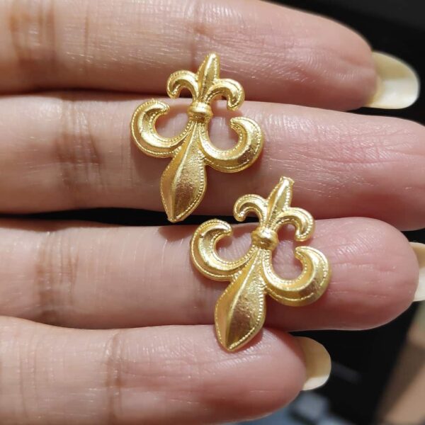 Fleur de lis Stud Earrings in Hands