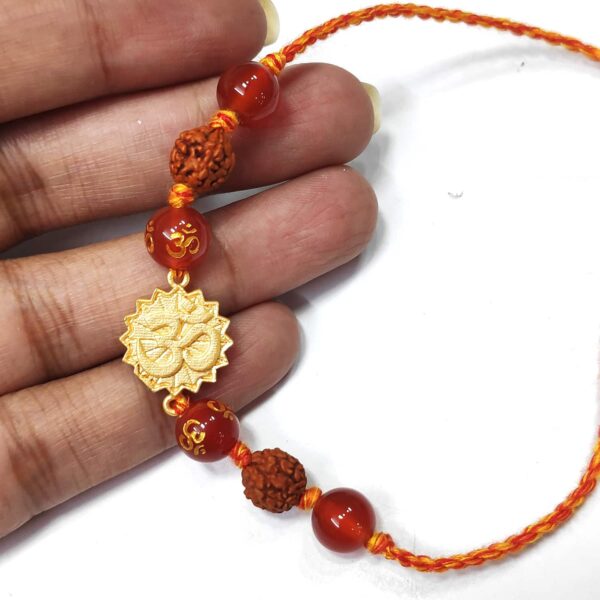 Natural Orange Gemstone Gold Plated OM and Rudraksha Rakhi Hand