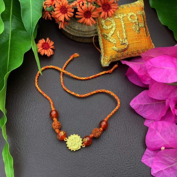 Natural Orange Gemstone Gold Plated OM and Rudraksha Rakhi Stylish