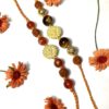 Orange Onyx and Tigers Eye Gold plated OM Rakhi Combo set Image
