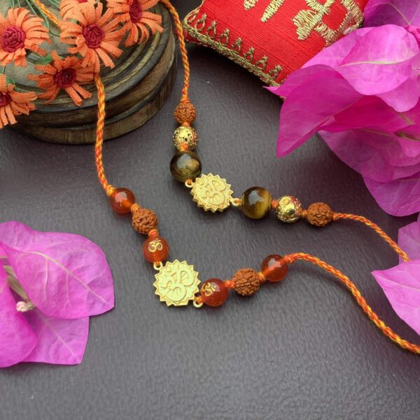 Natural Orange Onyx Gold plated OM and Tigers eye with Rudraksha Rakhi Combo set Stylish 1